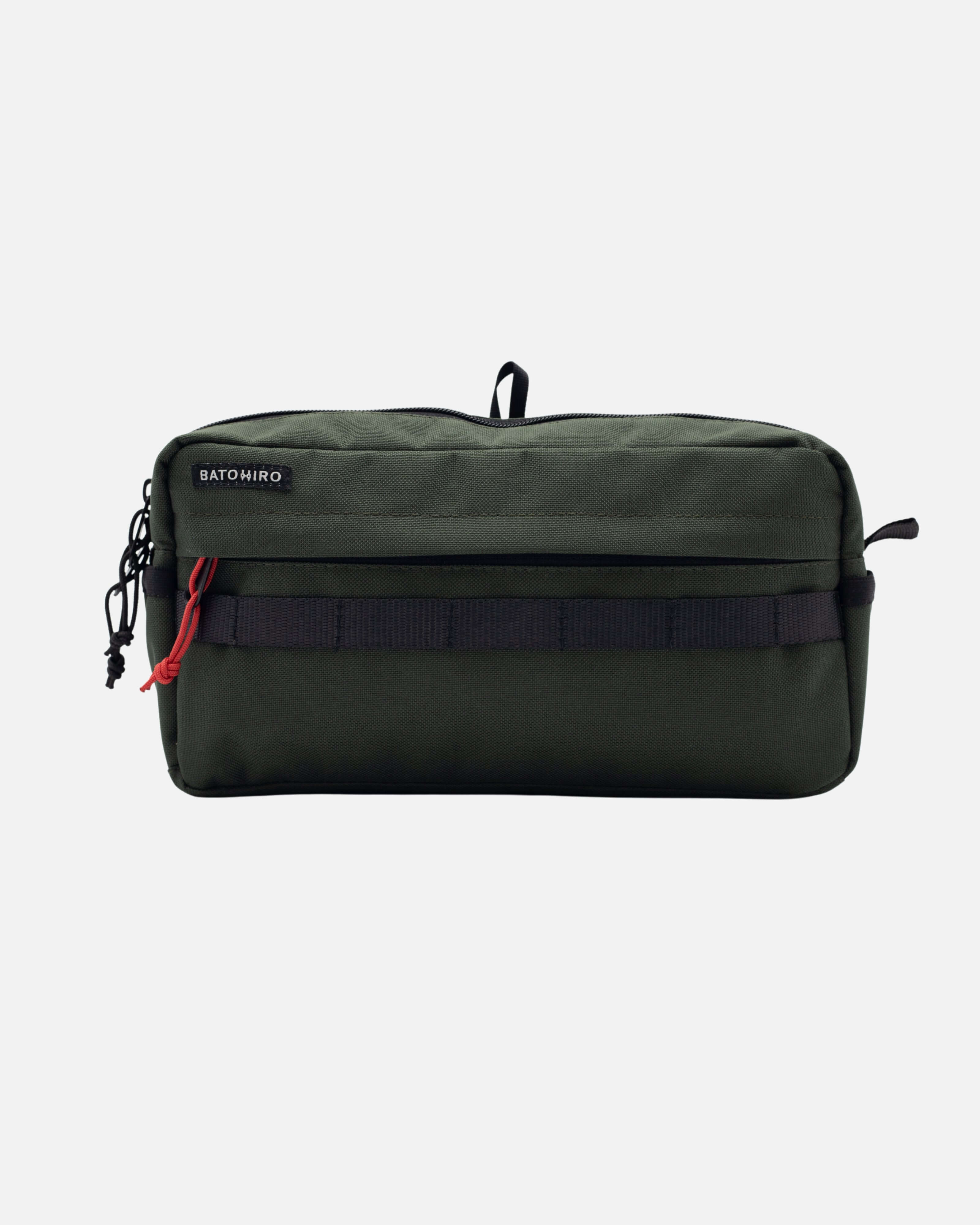 Cestovní ledvinka KAI v tmavě zelené barvě, vyrobená z nepromokavé CORDURA® 500D.